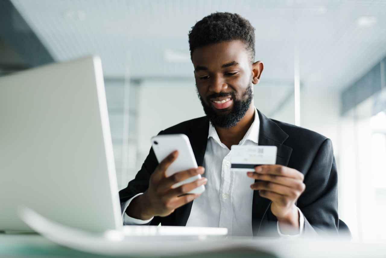 African American Man Gift Card Transaction