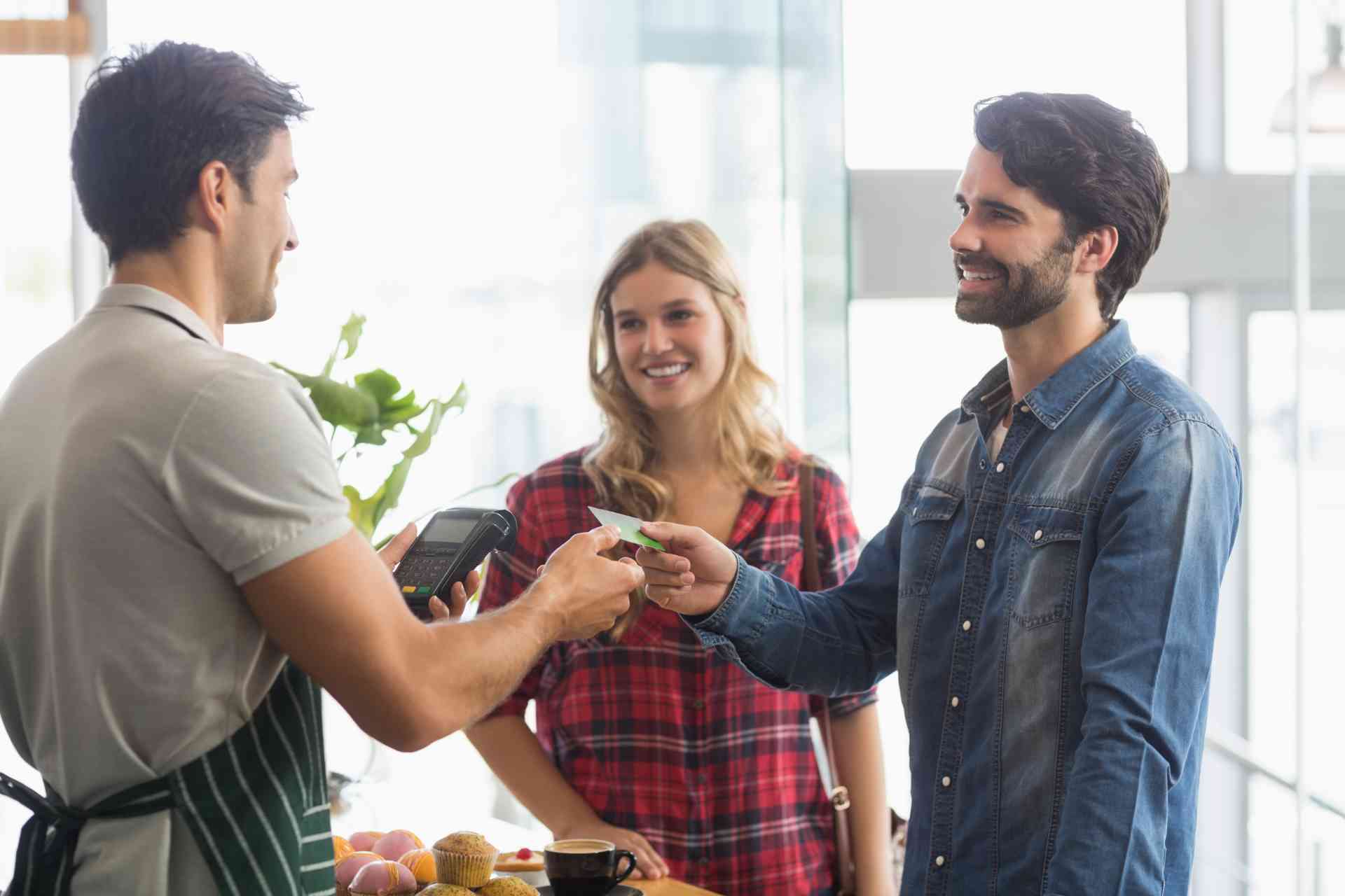 Couple Paying Bill Shop Using Card