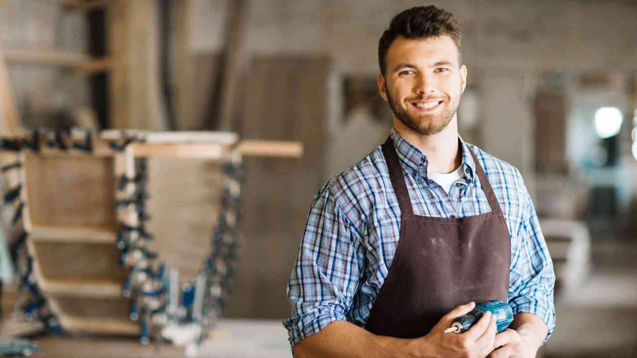 Smiling Craftsman with Electric Drill